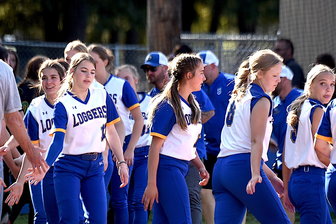 The Libby Loggers High School softball team celebrates its first win on its new field Thursday, May 1, 2025. The Loggers beat Whitefish, 15-0, in three innings. (Scott Shindledecker/The Western News)