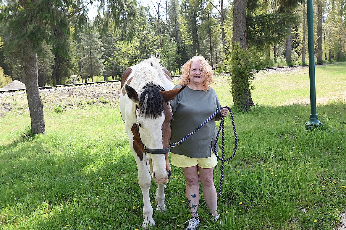 Troy's Tami Thill and her ???? horse Big John enjoy the spring weather and the high school softball teams' win over Thompson Falls Saturday, May 3, 2025. (Scott Shindledecker/The Western News)