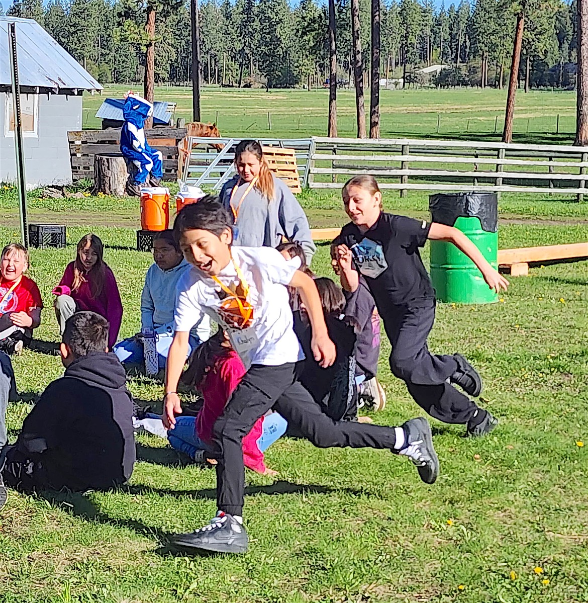 Pablo fourth graders play a lively game of Duck, Duck Goose during the annual Ag Days, coordinated by the Northwest Counties Farm Bureau, the Western Montana Stockmen's Association, MSU Lake County Extension, the Lake County Conservation District, and Department of Natural Resources and Conservation. (Berl Tiskus/Leader)