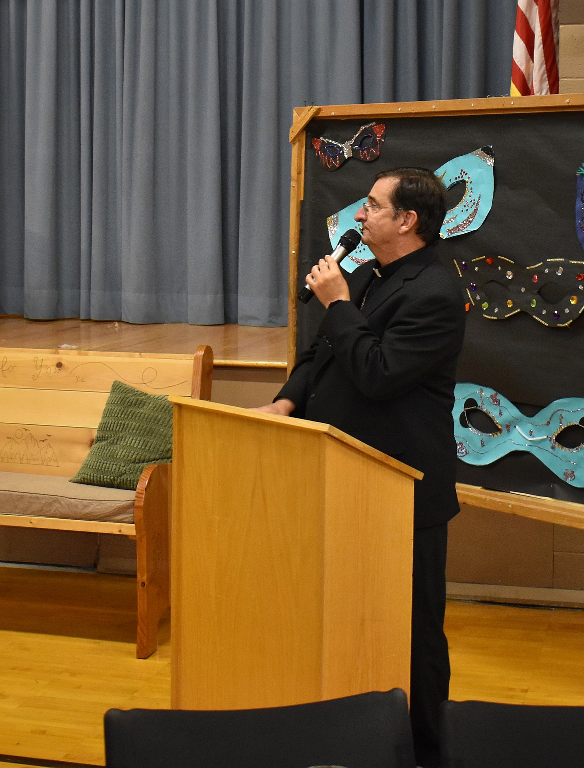 Catholic Bishop Joseph Tyson of the Yakima Diocese speaks at a St. Rose of Lima Catholic School function in November 2024. Tyson expressed concern about a state law that could potentially require priests to break the seal of the confessional if a confessor admits to abusing a child during confession.