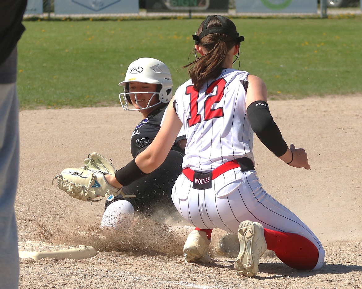 Mission senior Kensey Burke slides safely into third against Three Forks on May 3. (Caroline Roesch photo)