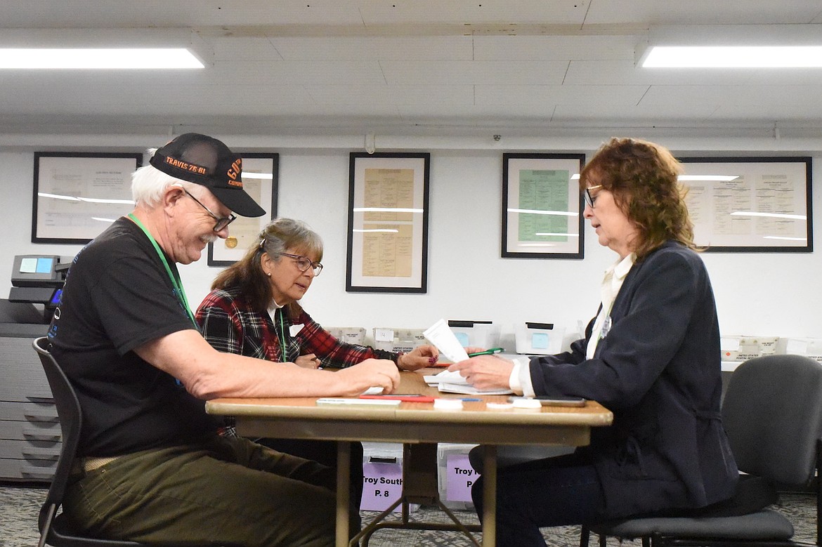 Lincoln County election judges, clockwise from left, Frank Thompson, Linda Rodriguez and Karen Edwards, hand count ballots on the evening of Tuesday, May 6, 2025, at the Lincoln County Election Office in the Annex building. Voters chose school trustees in Libby and Troy and voted on a Libby school levy. (Scott Shindledecker/The Western News)