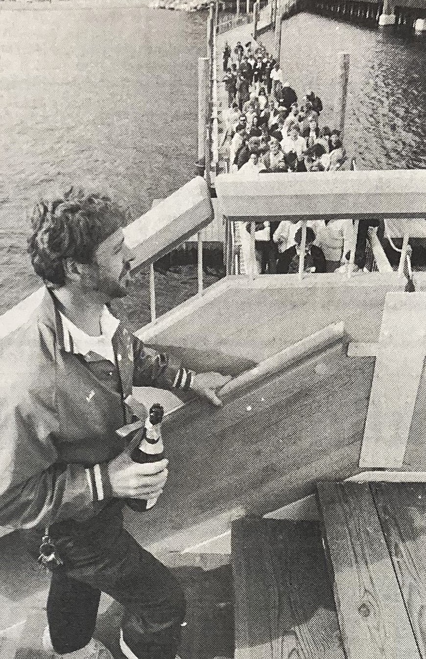 North Shore Marina manager Les Frank and travel officials tour new boardwalk May 10, 1985.