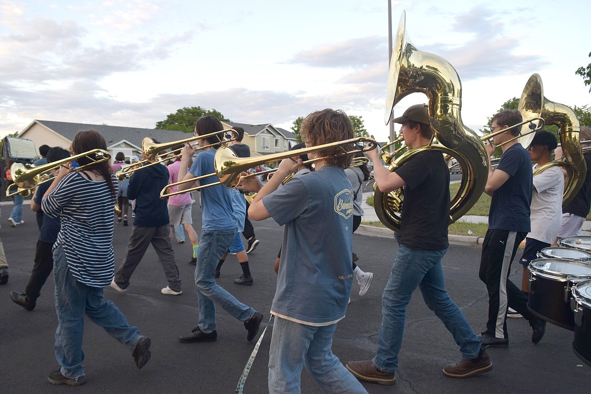 The Moses Lake High School marching band practices after school Wednesday in residential neighborhoods behind MLHS. Community members sat in lawn chairs as the students marched by.