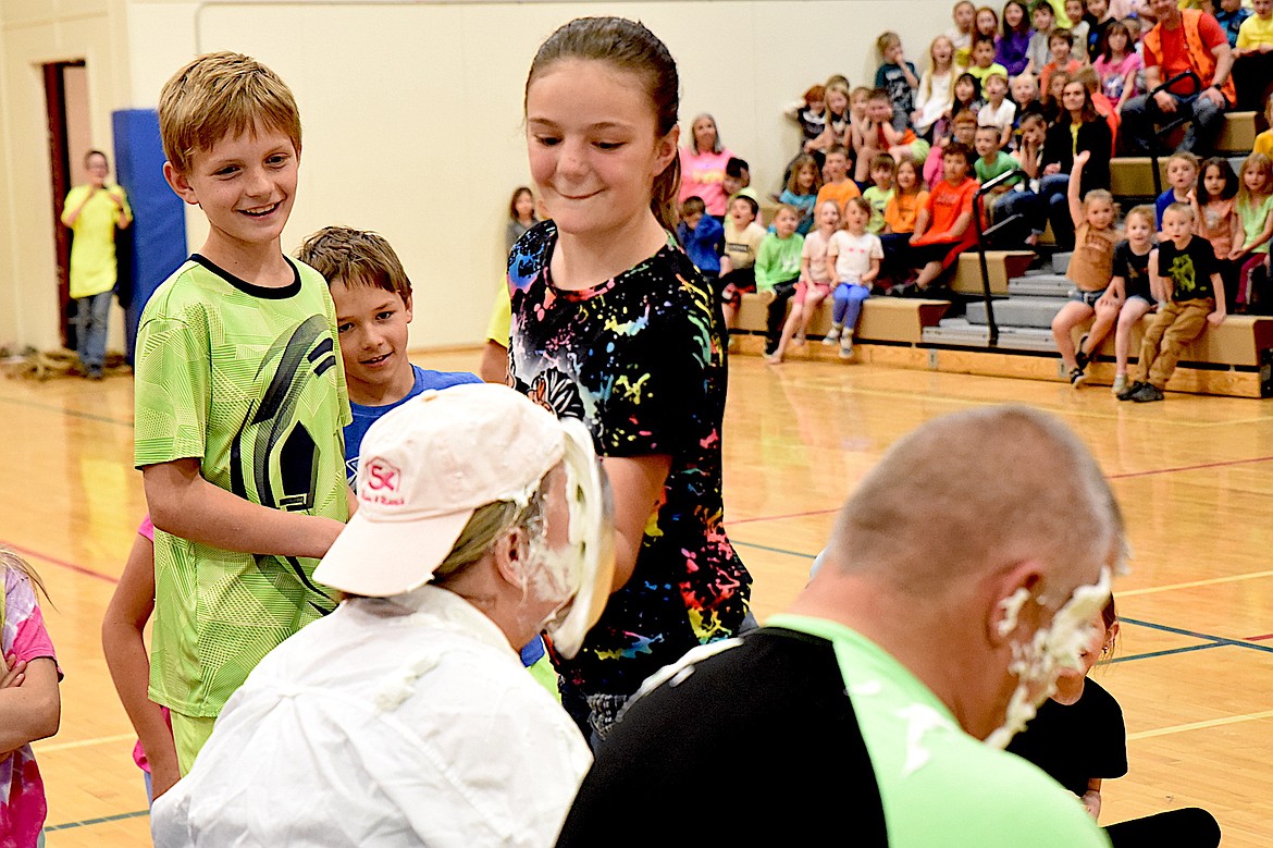 Libby Elementary School student Leah Sharp plants a cream pie in School Principal Jeanine Kidwell's face while Caleb Peterson watches Friday, May 9, 2025, during the Spirit Assembly. (Scott Shindledecker/The Western News)