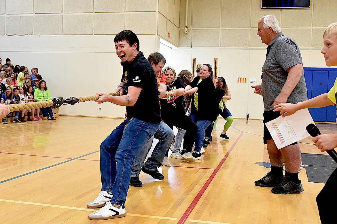 Libby Elementary School fourth grade teacher Joe Flores leads the educators against the students in a game of tug-of-war Friday, May 9, 2025, during the Spirit Assembly. (Scott Shindledecker/The Western News)