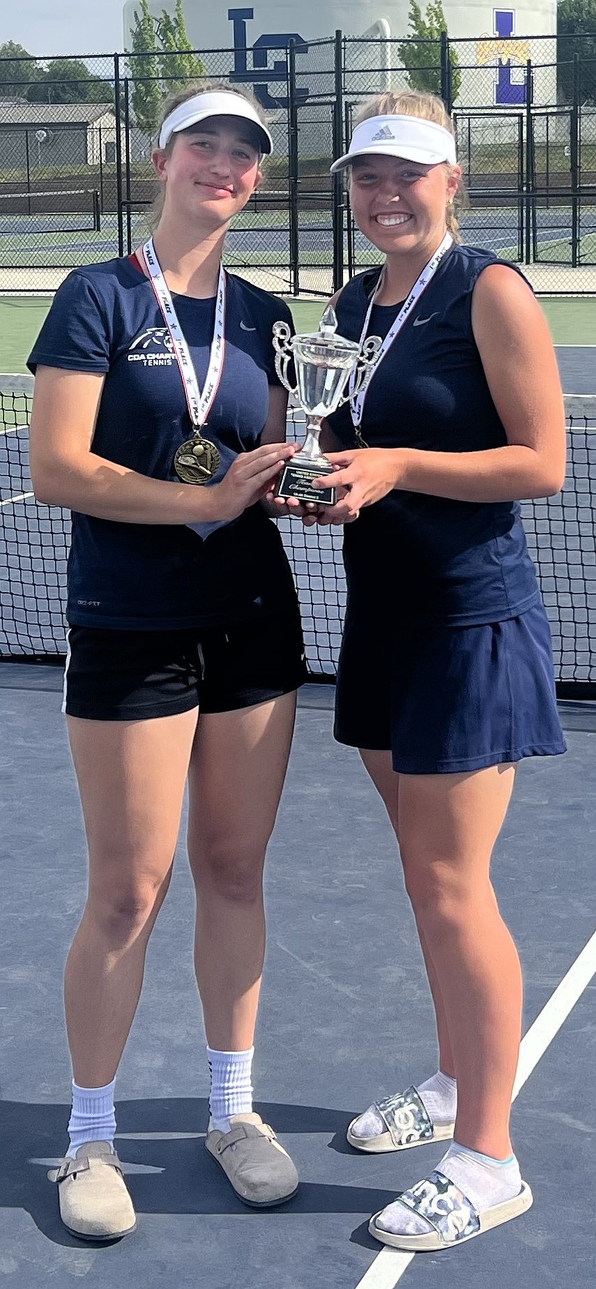 Courtesy photo
Lydia Lehosit, left, and Claire Leahy of Coeur d'Alene Charter Academy won their second straight girls doubles district title at the 4A District 1-2 tournament Saturday in Lewiston.