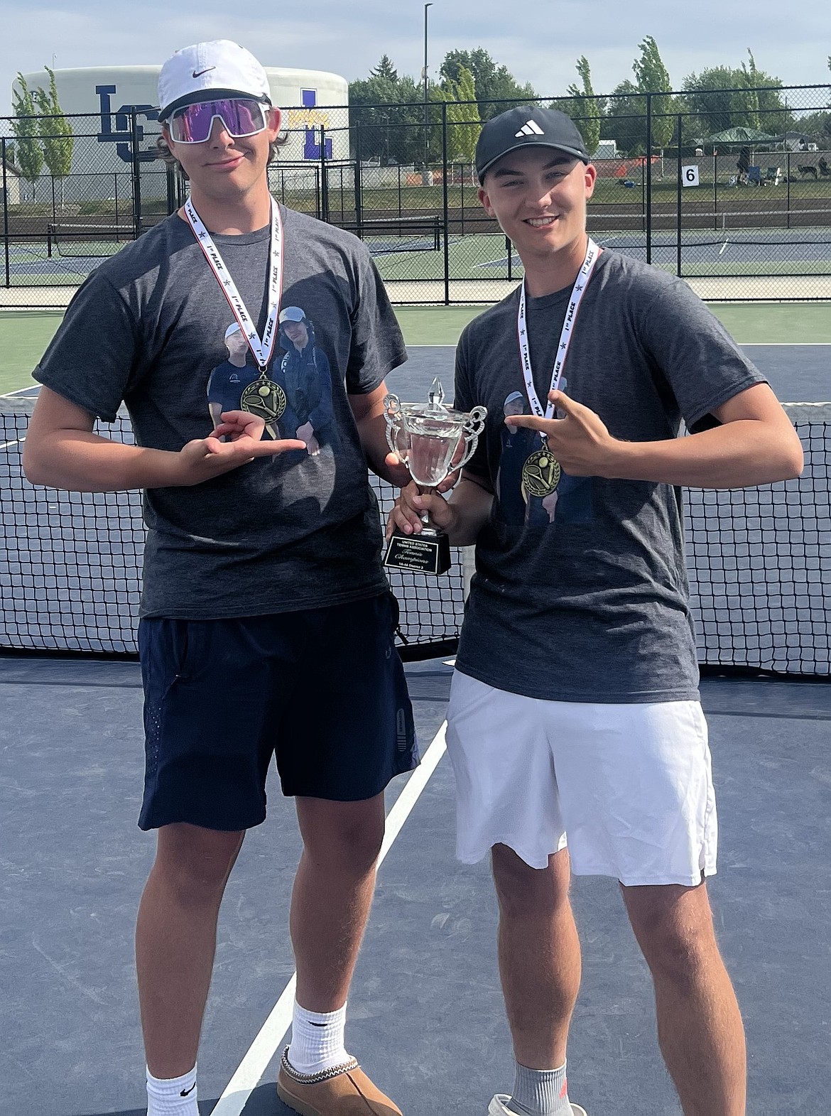 Courtesy photo
Owen Sharp, left, and Tate Burkholder of Coeur d'Alene Charter Academy won their third straight boys doubles district title at the 4A District 1-2 tournament Saturday in Lewiston.