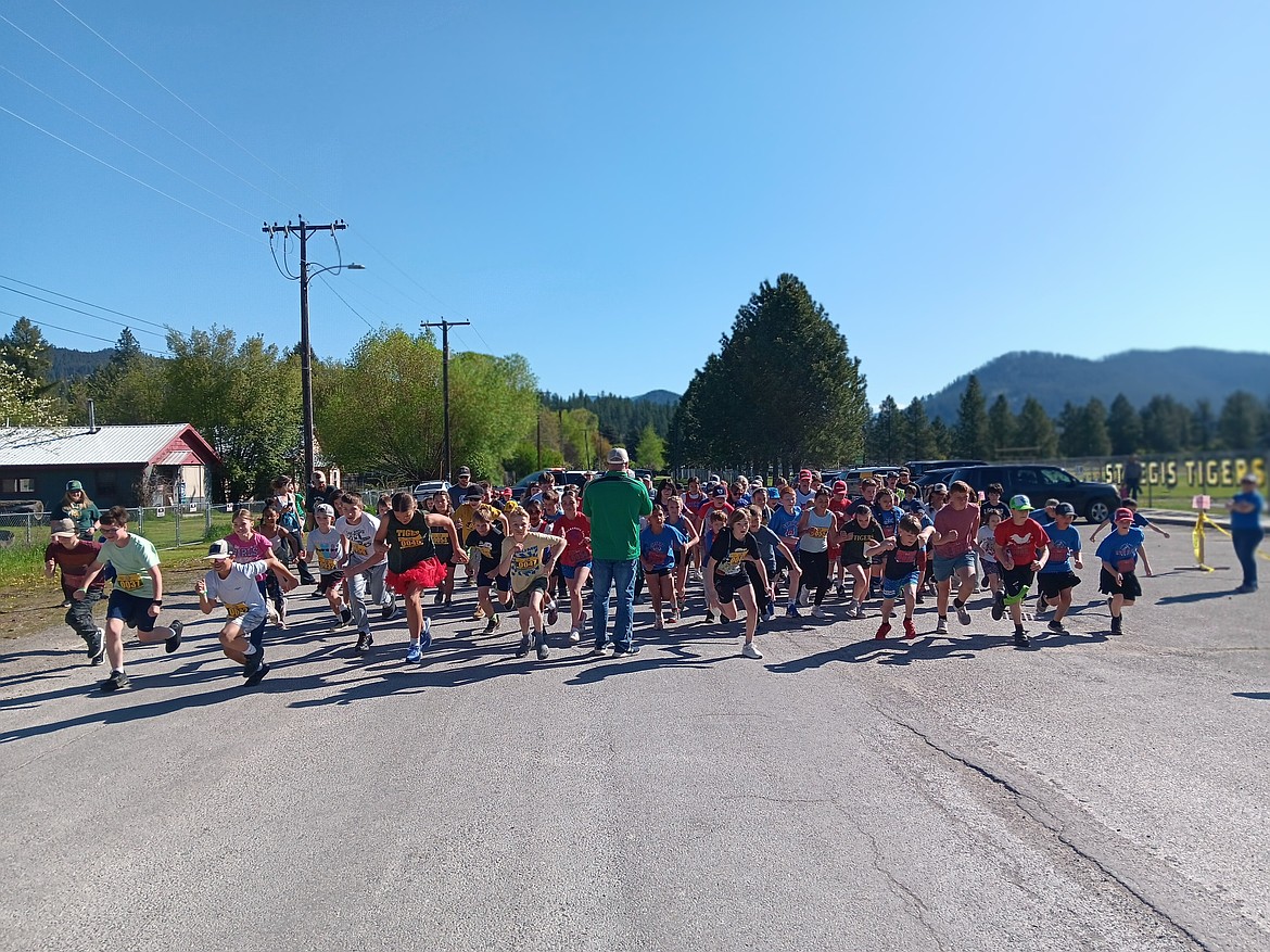 The 5K was for the older students but younger ones could participate if they had a written permission slip. This year’s course was straight out Camels Hump Road to the water station at the halfway point and then back to the St. Regis School for lunch. (Monte Turner/Mineral Independent)