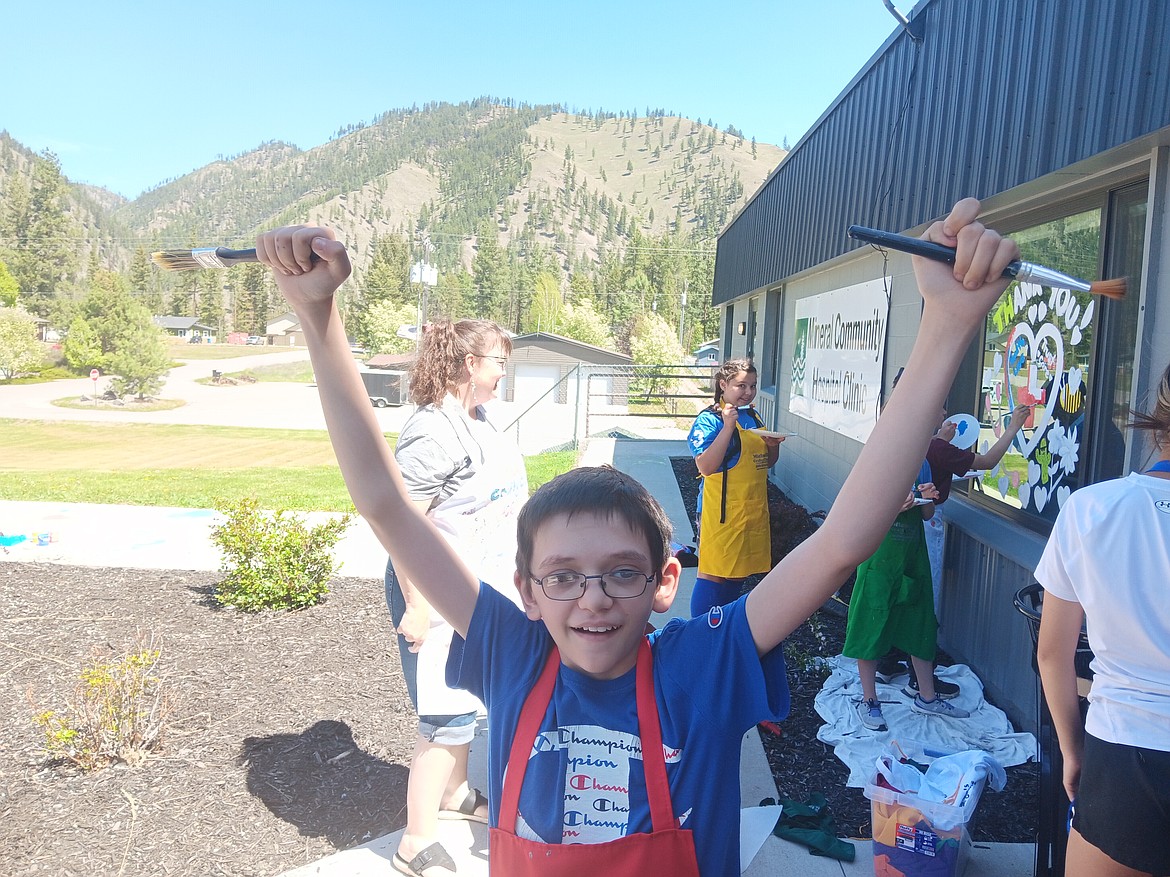 Colton Brown was enjoying the day after participating in the All-School Fun Run in St. Regis earlier that morning and then being outside painting windows in Superior. And a 3-day weekend was coming up so who couldn’t blame him for being so happy? (Monte Turner/Mineral Independent)