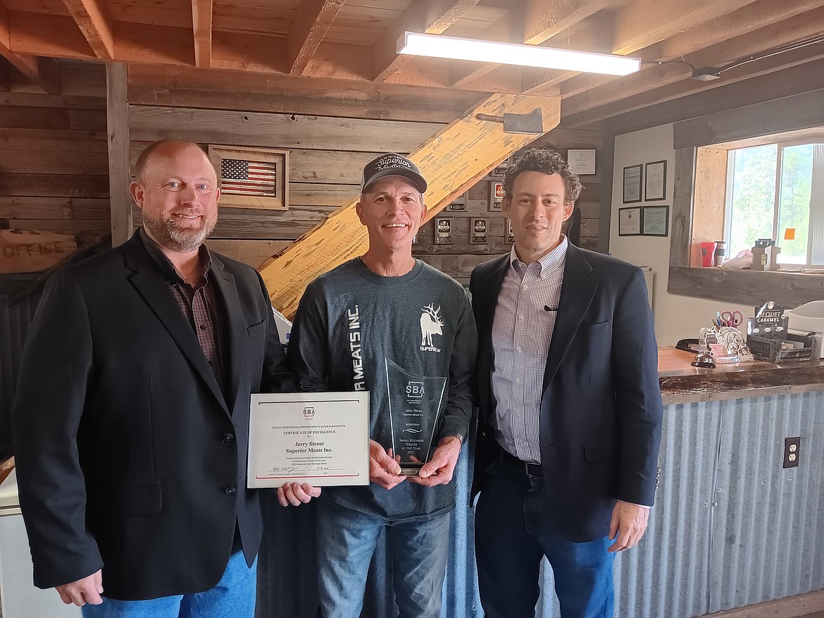Brent Donnelly, Small Business Association district director, and Justin Everette, SBA regional administer, straddle Jerry Stroot owner of Superior Meats and recipient of the Small Business Person of Montana. Jerry and his wife, Sandy's children and their spouses were in attendance with representatives from Gov. Greg Gianforte, Sen. Steve Daines, Sen. Tim Sheehy and Rep. Zinke offices. State Sen. Denley Loge spoke on his long and rewarding relationship with Superior Meats while customers and friends enjoyed lunch inside the retail section of the meat processing facility on Friday. May 4-10 was National Small Business Week.
