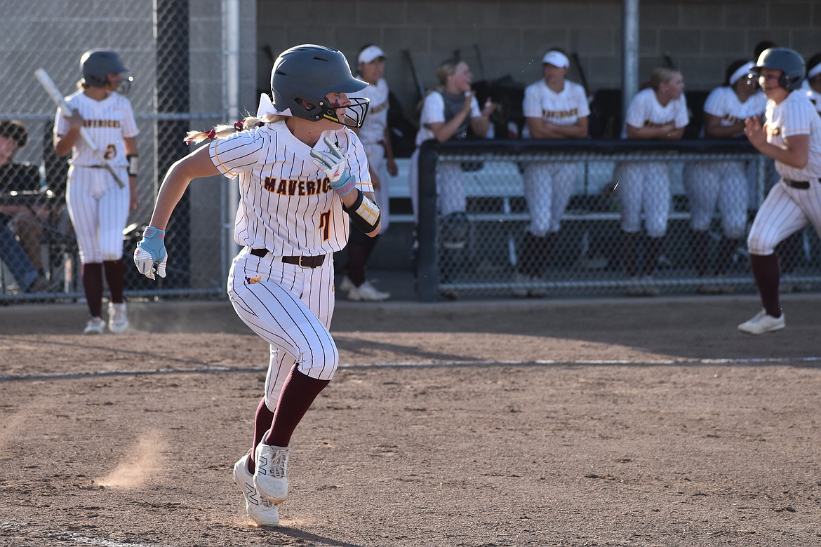Collecting multiple hits in game one and leading the team in runs batted in in game two, Lila Johnson makes a run towards first base.