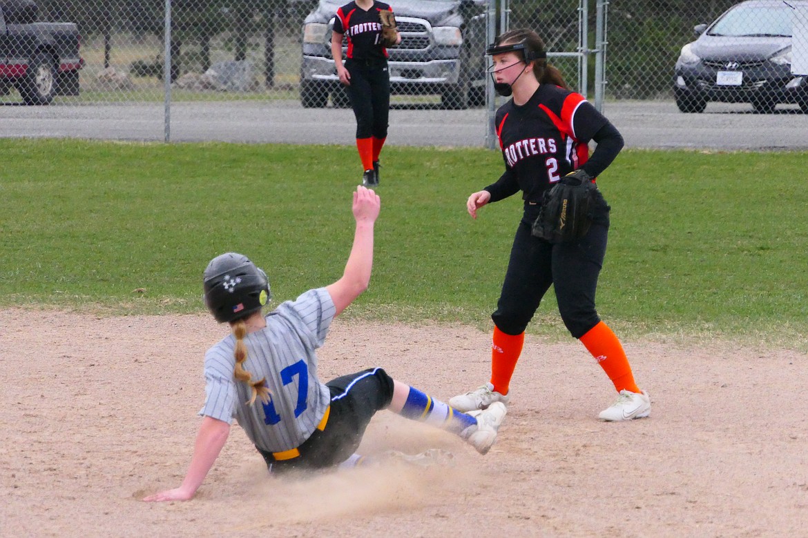 A Kalispell runner slides safely into second base ahead of a tag attempt during their game versus the Trotters this past week in Plains.  (Chuck Bandel/VP-MI)