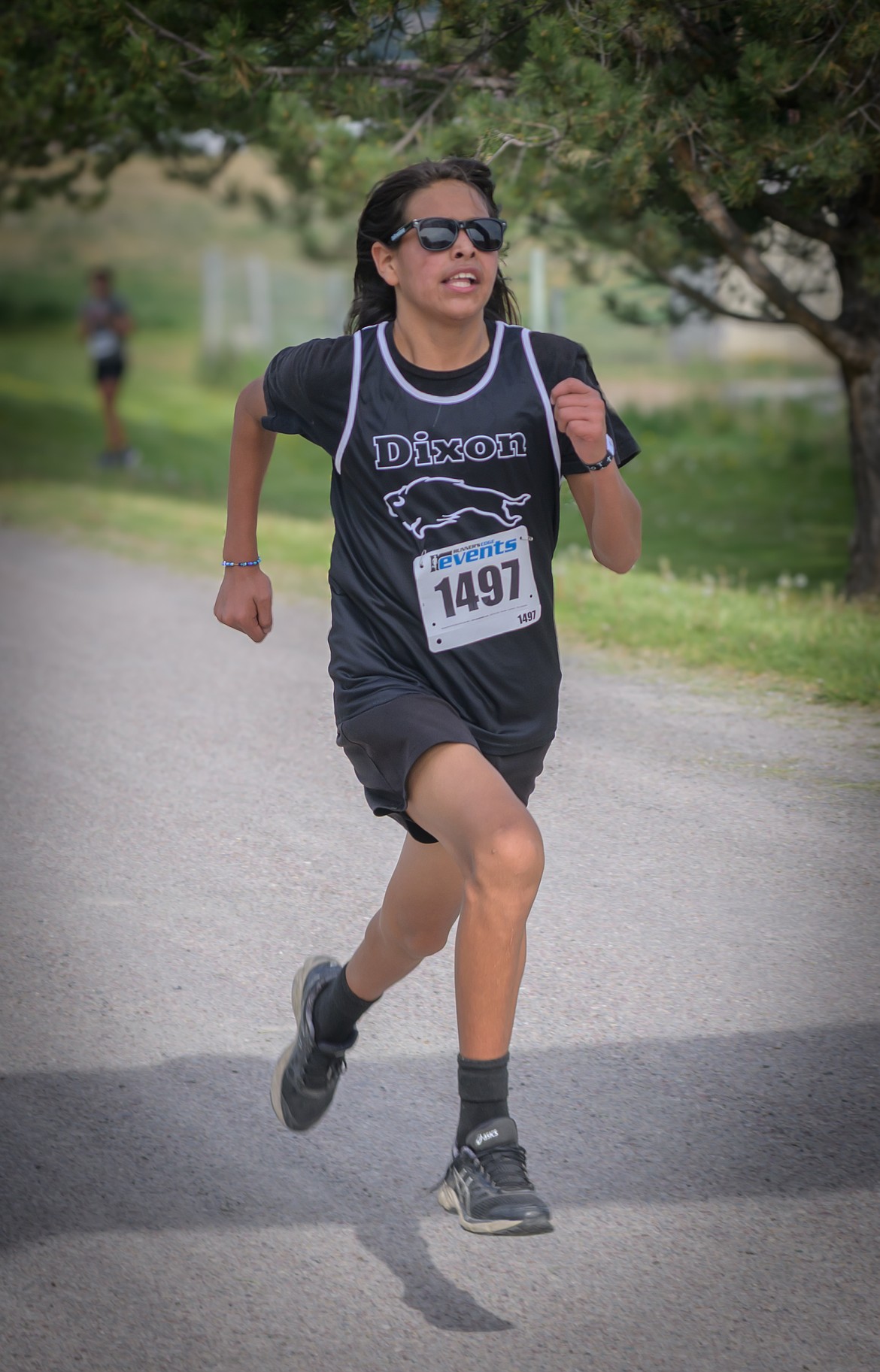 Eighth-grader Sunny Matt races to first place in the Bison Stampede 10K race. (Tracy Scott/Valley Press)