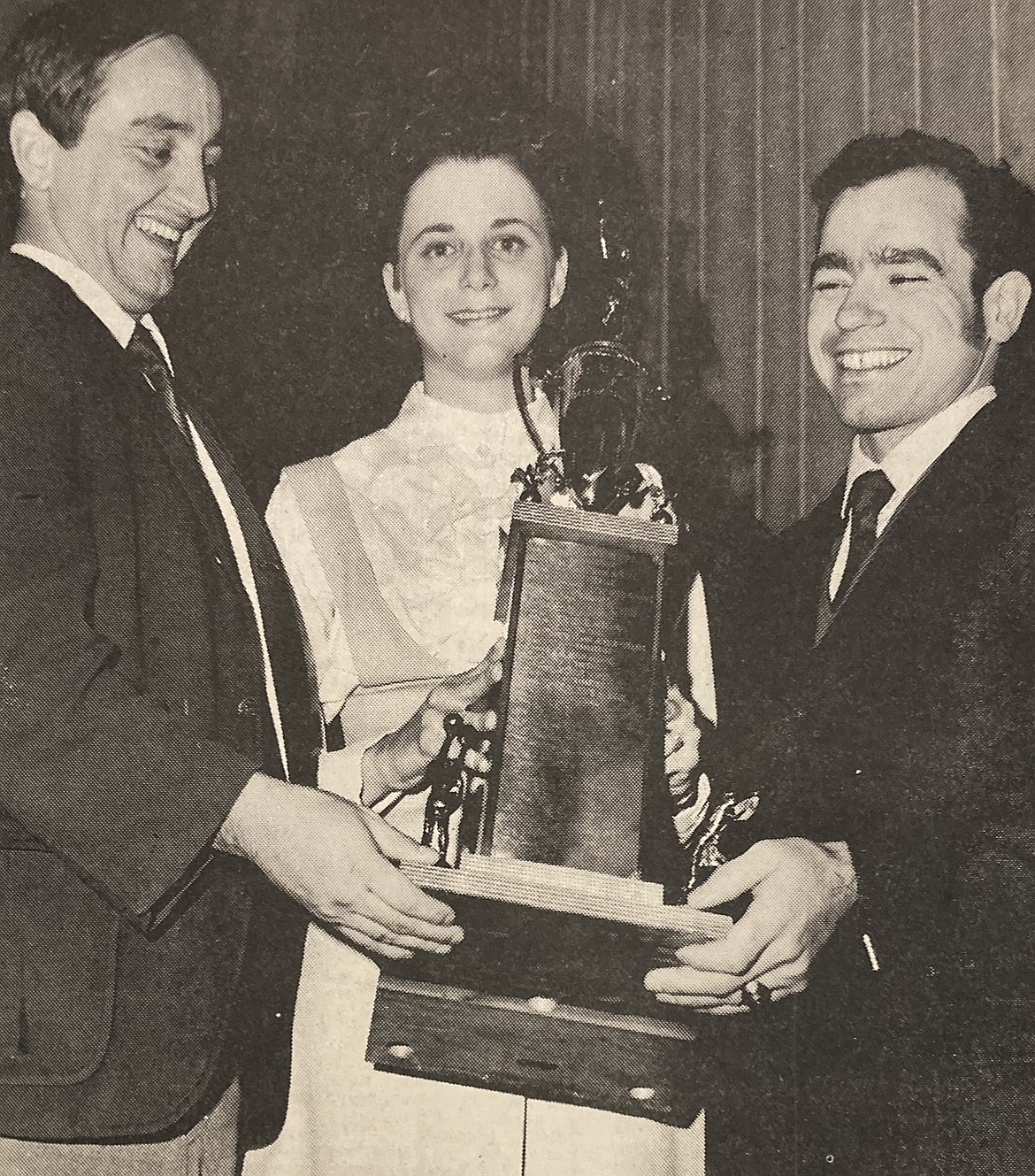 Coach Gene Boyle of the Immaculate Heart of Mary Academy, left, his wife, Barbara, and assistant coach John DeLong accept Team of the Year honors at the 8th Annual Sports Banquet on Jan. 22, 1970. Boyle also was named Coach of the Year after his 1969 football team finished 9-0.