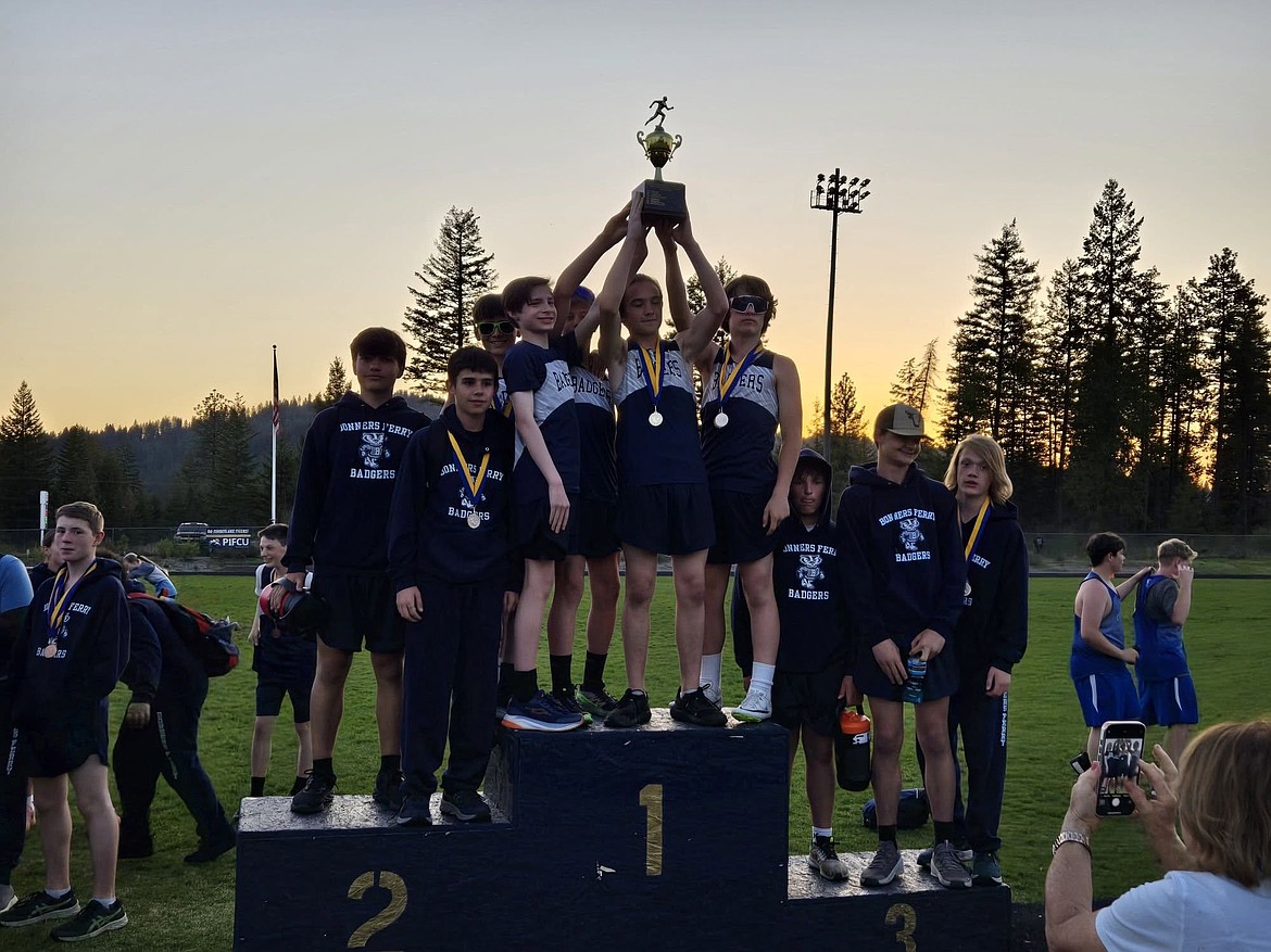 Members of the Boundary County Middle School seventh grade boys track & field team hoist up the second-place team trophy they won at the middle school district championship meet.