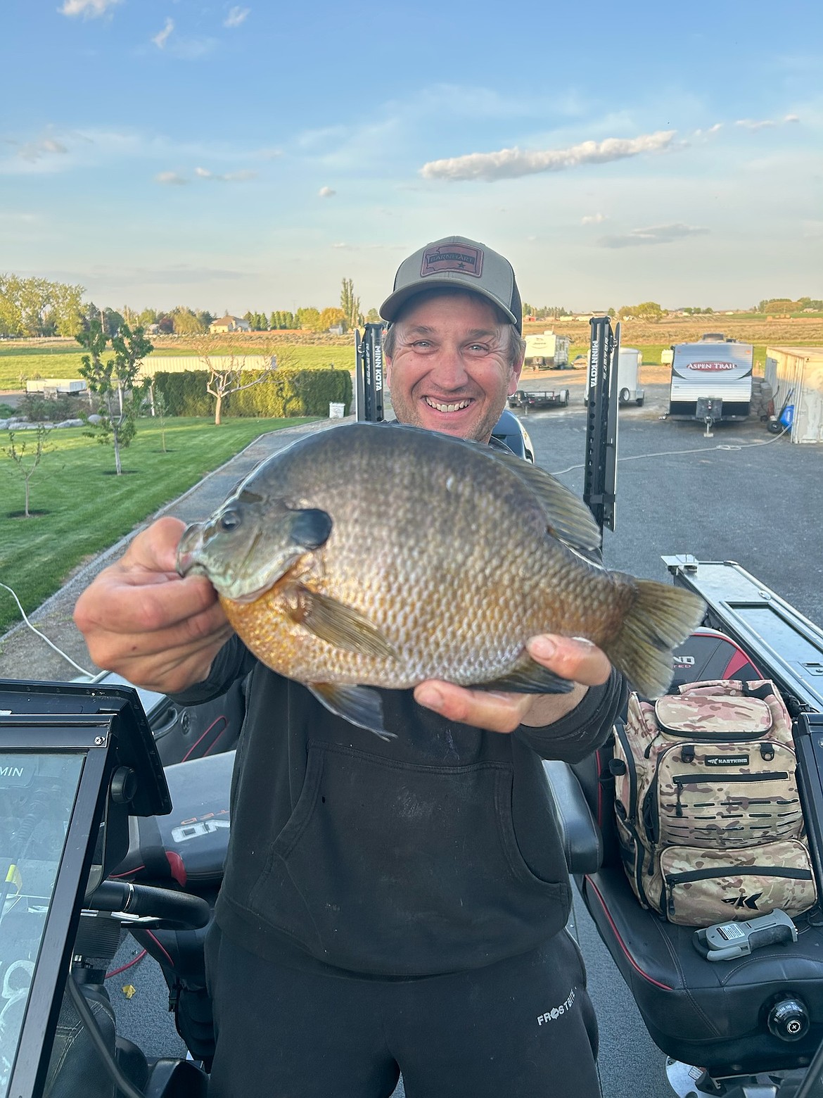 Chad Halvorson holds a 2-pound 6-ounce bluegill he caught in the dunes at Potholes.