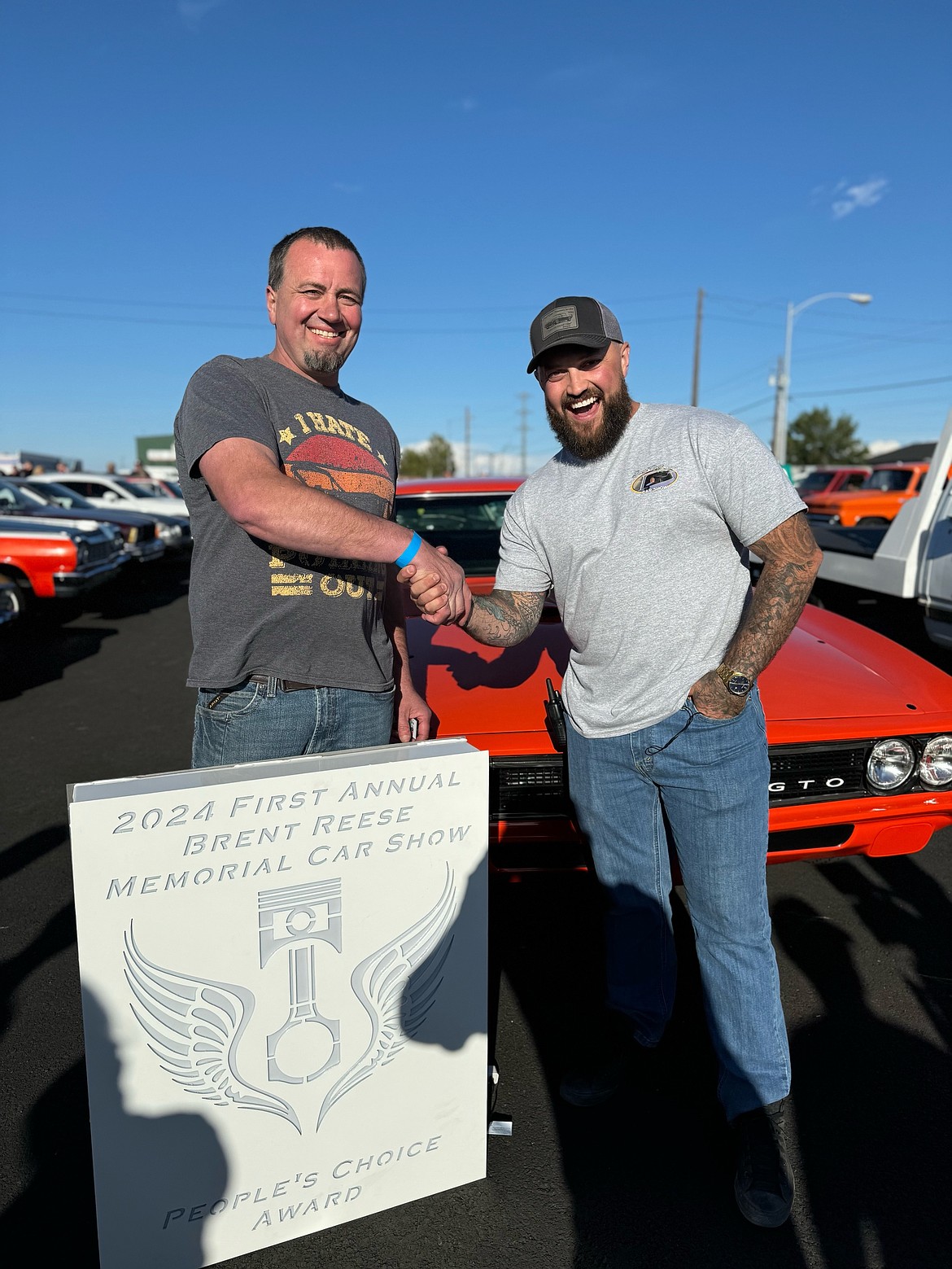 Jeremy Reese, right, presents Joe Smith with the People’s Choice award at last year’s Brent Reese Memorial Car Show.