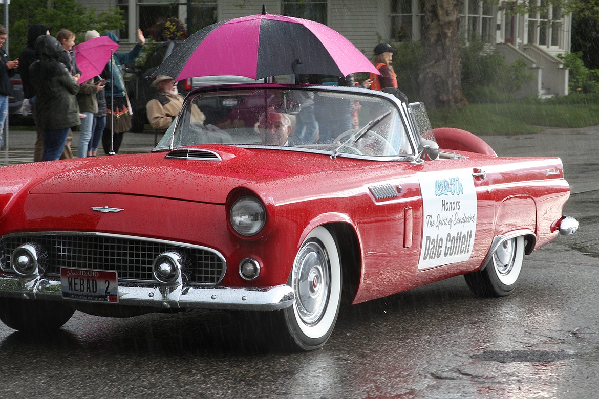 Dale Coffelt, selected as the "Spirit of the '50s" parade marshal, smiles as he's driving down the parade route during Friday's Lost in the '50s classic car cruise.