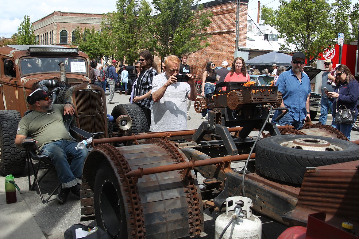 Aaron Post smiles as he watches Lost in the '50s fans check out his "rat rod" at Saturday's annual car show in downtown Sandpoint.