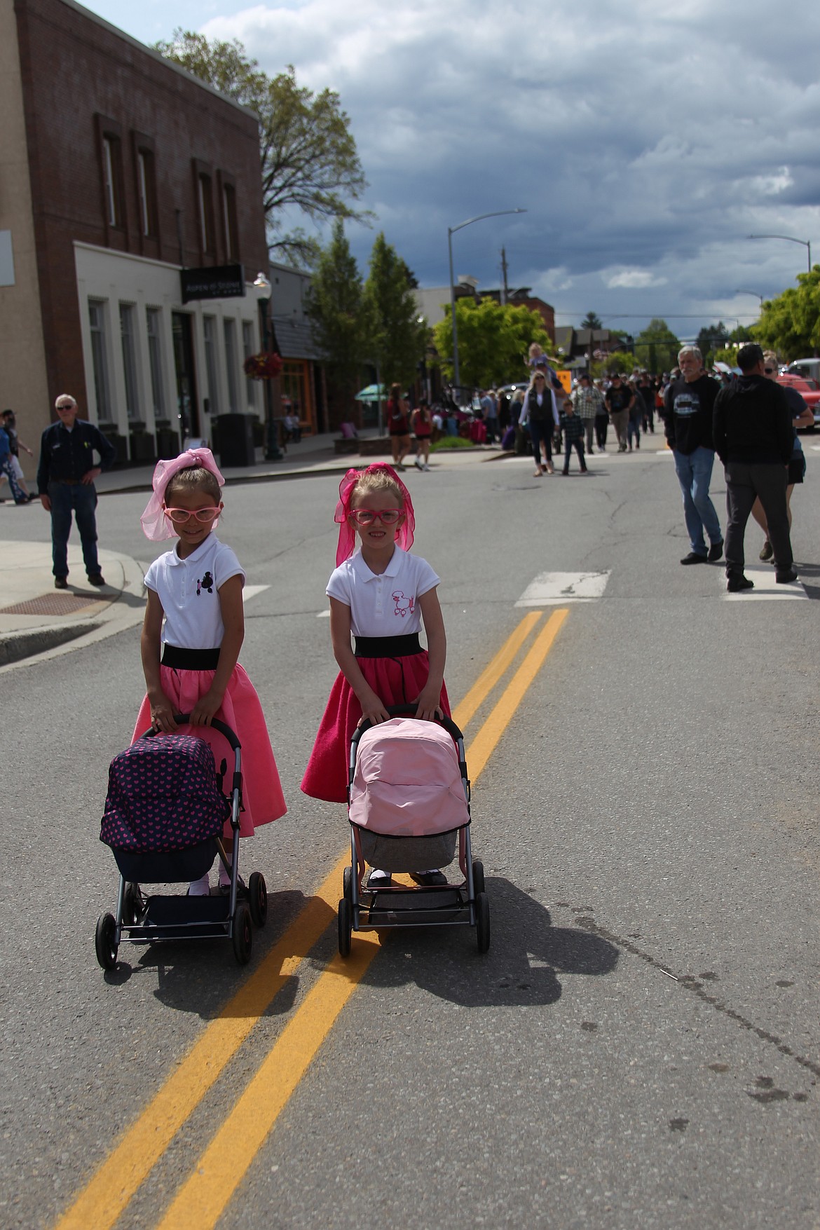 Piper and Finley Kizanis show off their '50s style as they take in the sights and sounds of Saturday's annual Lost in the '50s car show.
