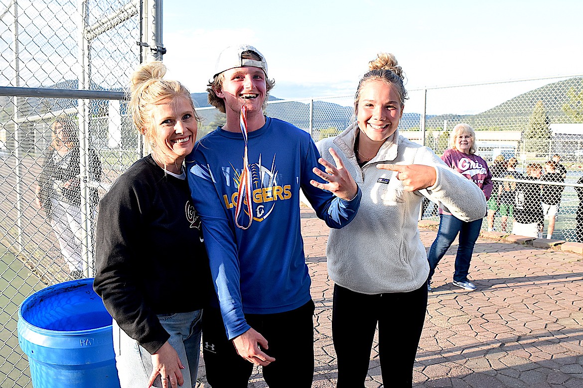 Libby High School tennis player Ryan Beagle, his mom and a good friend from Columbia Falls celebrate the singles title Beagle won at the Northwest A Divisional Tournament Saturday, May 17, 2025, in Libby. (Scott Shindledecker/The Western News)