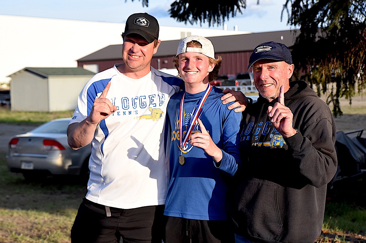Libby High School tennis player Ryan Beagle, head coach Kyle Hannah and assistant coach Terry Oedewaldt celebrate the singles title Beagle won at the Northwest A Divisional Tournament Saturday, May 17, 2025, in Libby. (Scott Shindledecker/The Western News)
