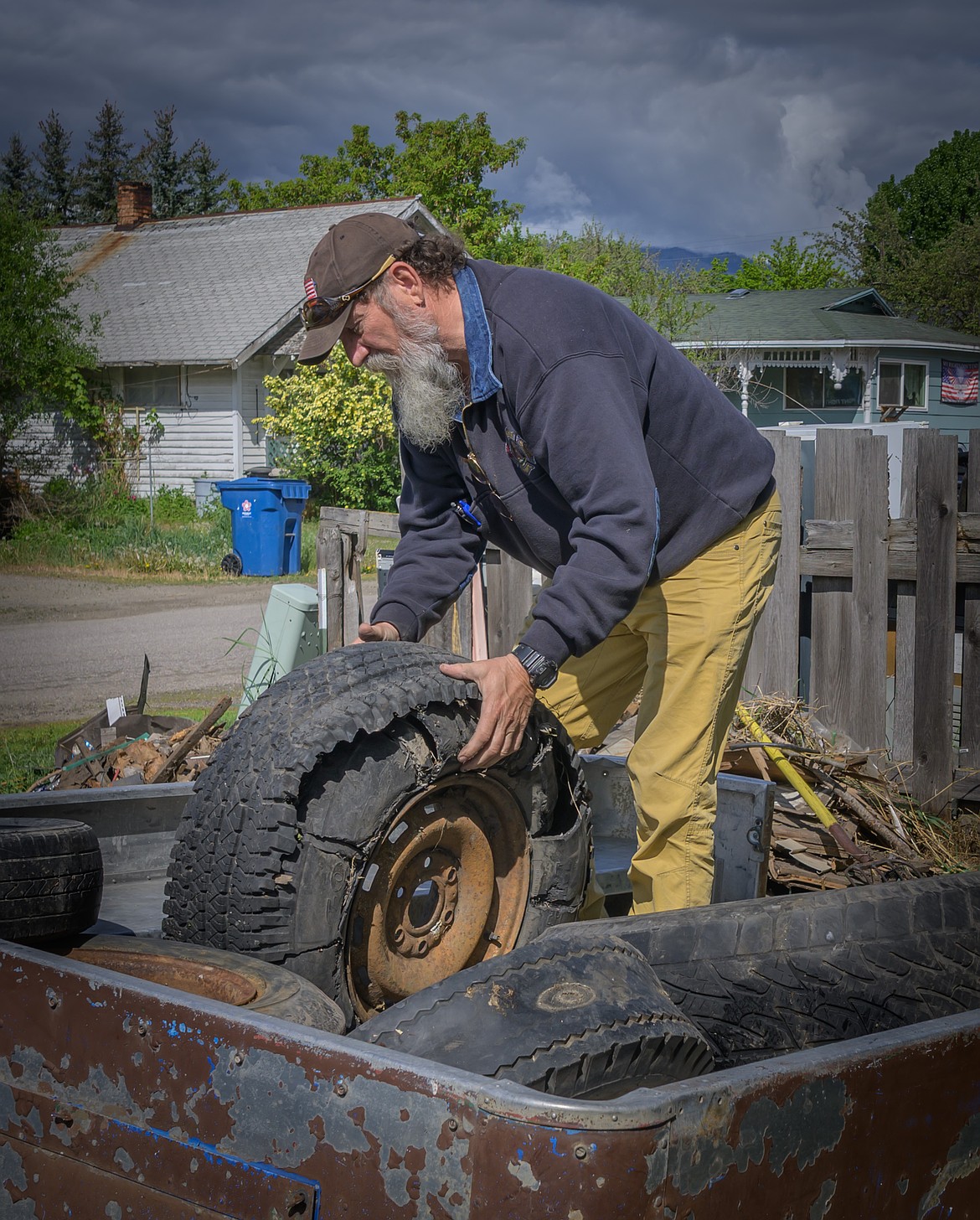 Plains Mayor Joel Banham collects tires for recycling during Plains Beautification Days. (Tracy Scott/Valley Press)