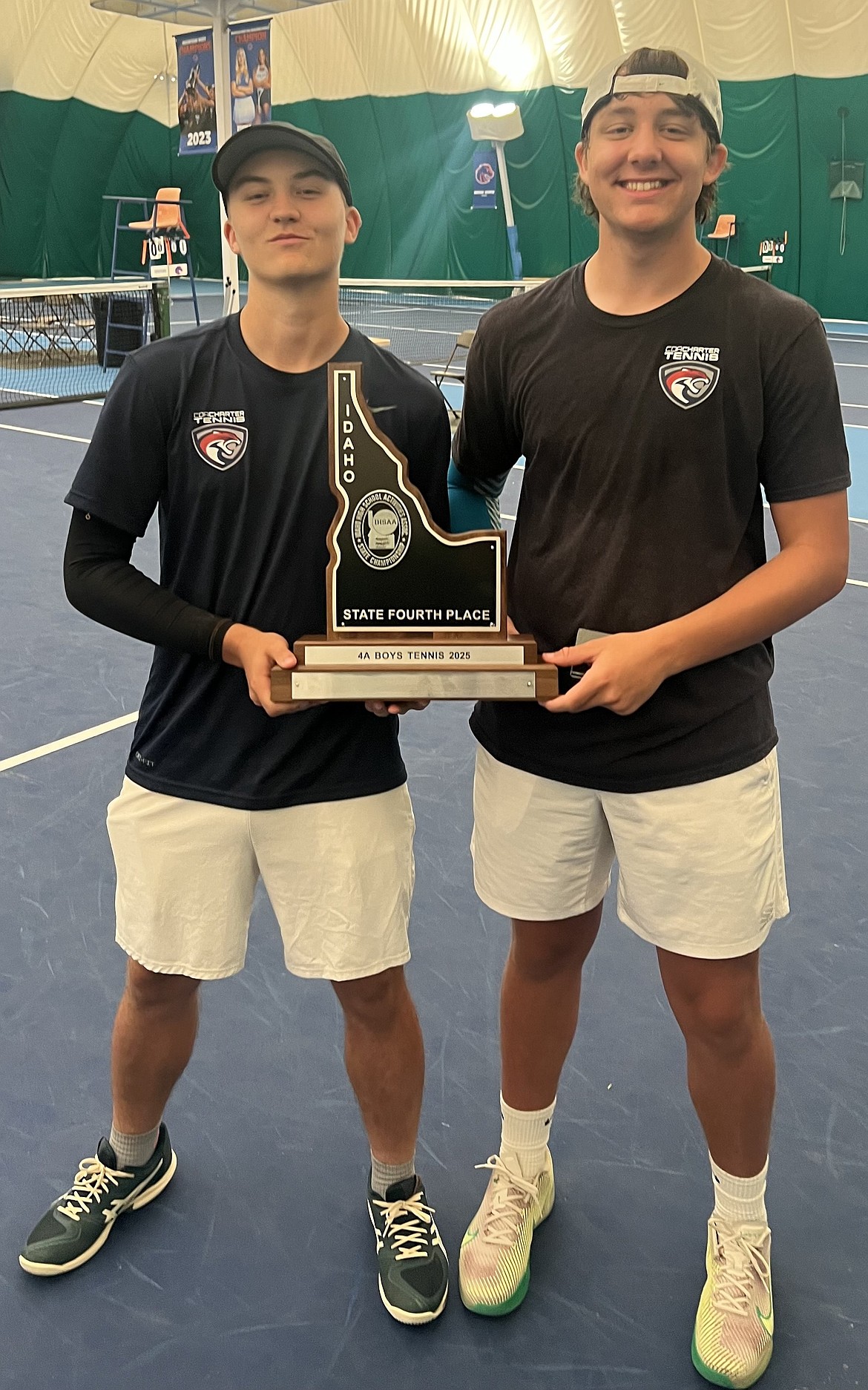 Courtesy photo
The Coeur d'Alelne Charter boys doubles team of Tate Burkholder, left, and Owen Sharp hold the boys 4A team fourth-place trophy at last weekend's state tennis tournament. Burkholder and Sharp won the boys doubles consolation finals, 6-3 6-3 over Trevor Mann and Nathan Compas of Parma. The Panther boys placed fourth in 4A.