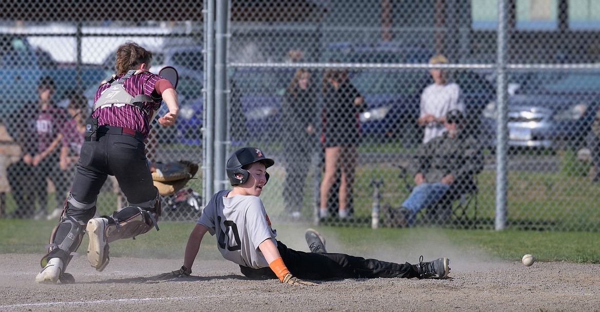 Plains-Hot Springs' Wyatt Miller slides safely across home plate during the Savage Horsemen's season ending game versus Troy this past week in Plains. (Tracy Scott/Valley Press)