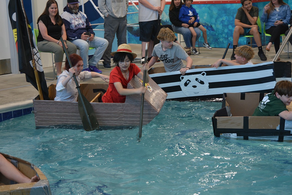 The cardboard boats occasionally pinned each other during their race heats at SafeSplash while students from Woodland Middle School tried to complete laps in the pool.