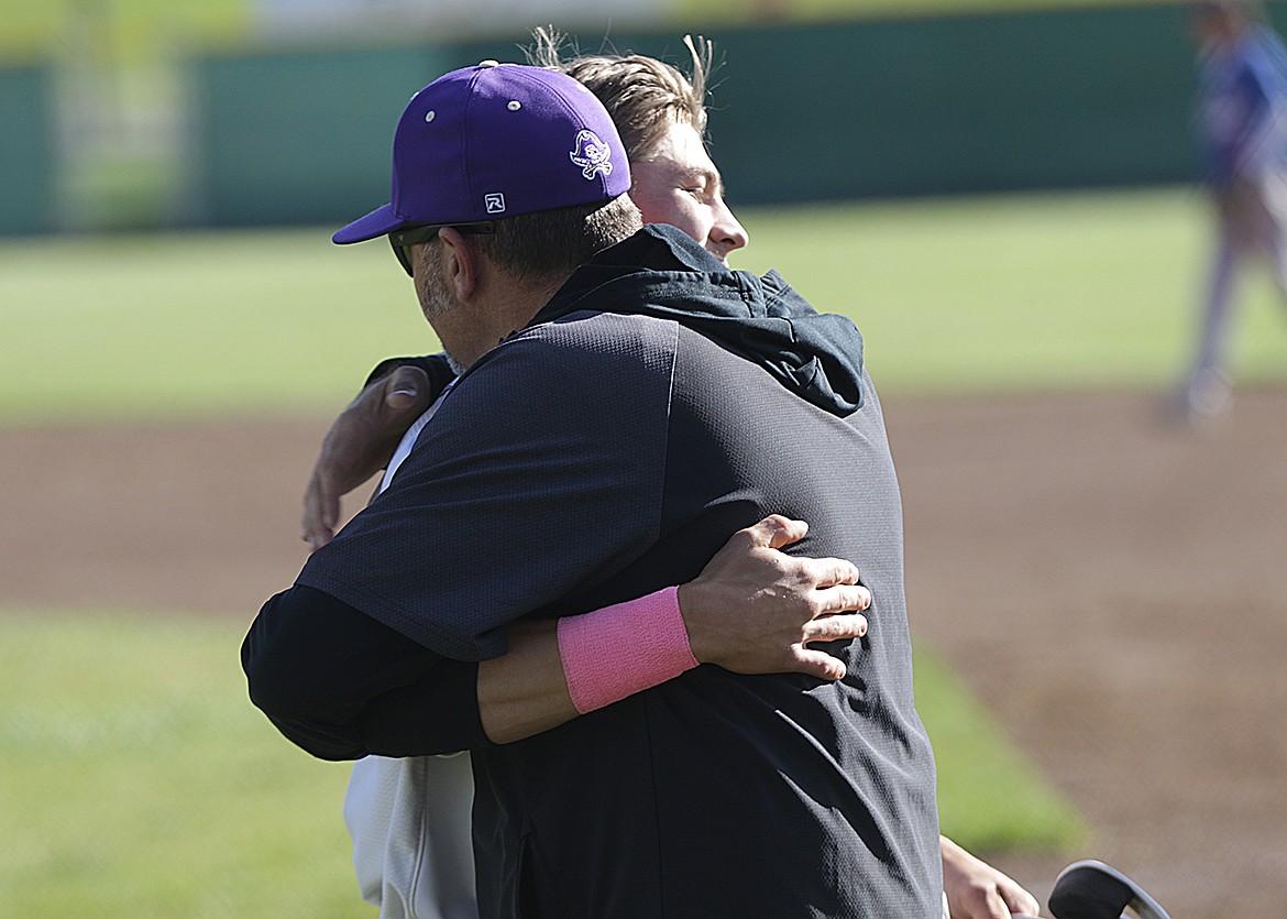 Senior Landon Shoemake gets a hug from the coach during Senior Night, May 12, after accruing two home runs. Despite a 14-7 overall record the Pirates fell short of a state tournament berth this season. (Bob Gunderson photo)