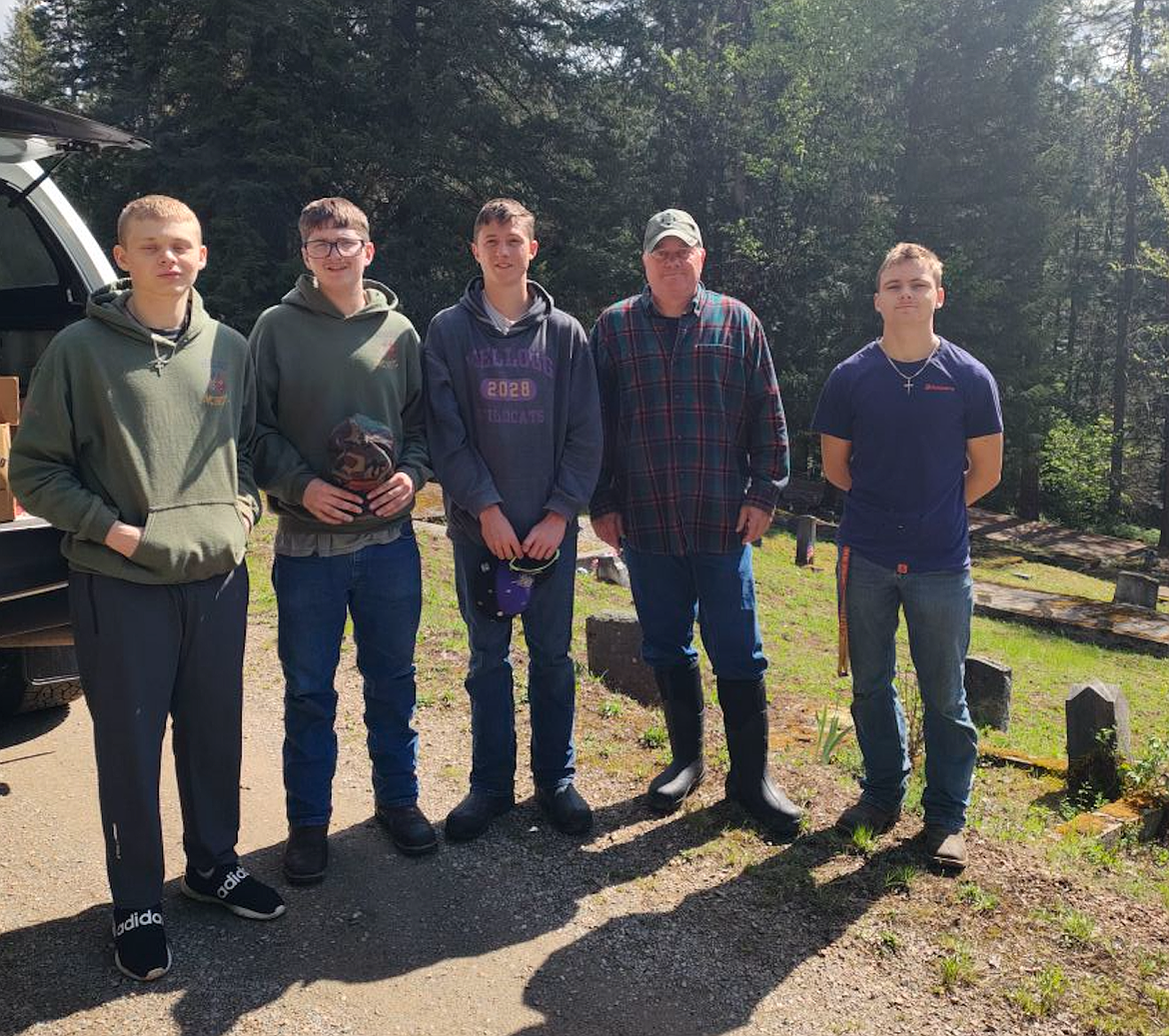 Cadets with the Kellogg High School Marine Corps JROTC program assisted members of the Shoshone County VFW in a cleanup at Nine Mile Cemetery near Wallace. The cleanup was part of their efforts to get the cemetery ready for visitors on Memorial Day. Pictured from the left are cadets Pax Hyatt, Roman Roth, Alex Cassidy, VFW Post Commander Chris Marker, and Spencer Strange.