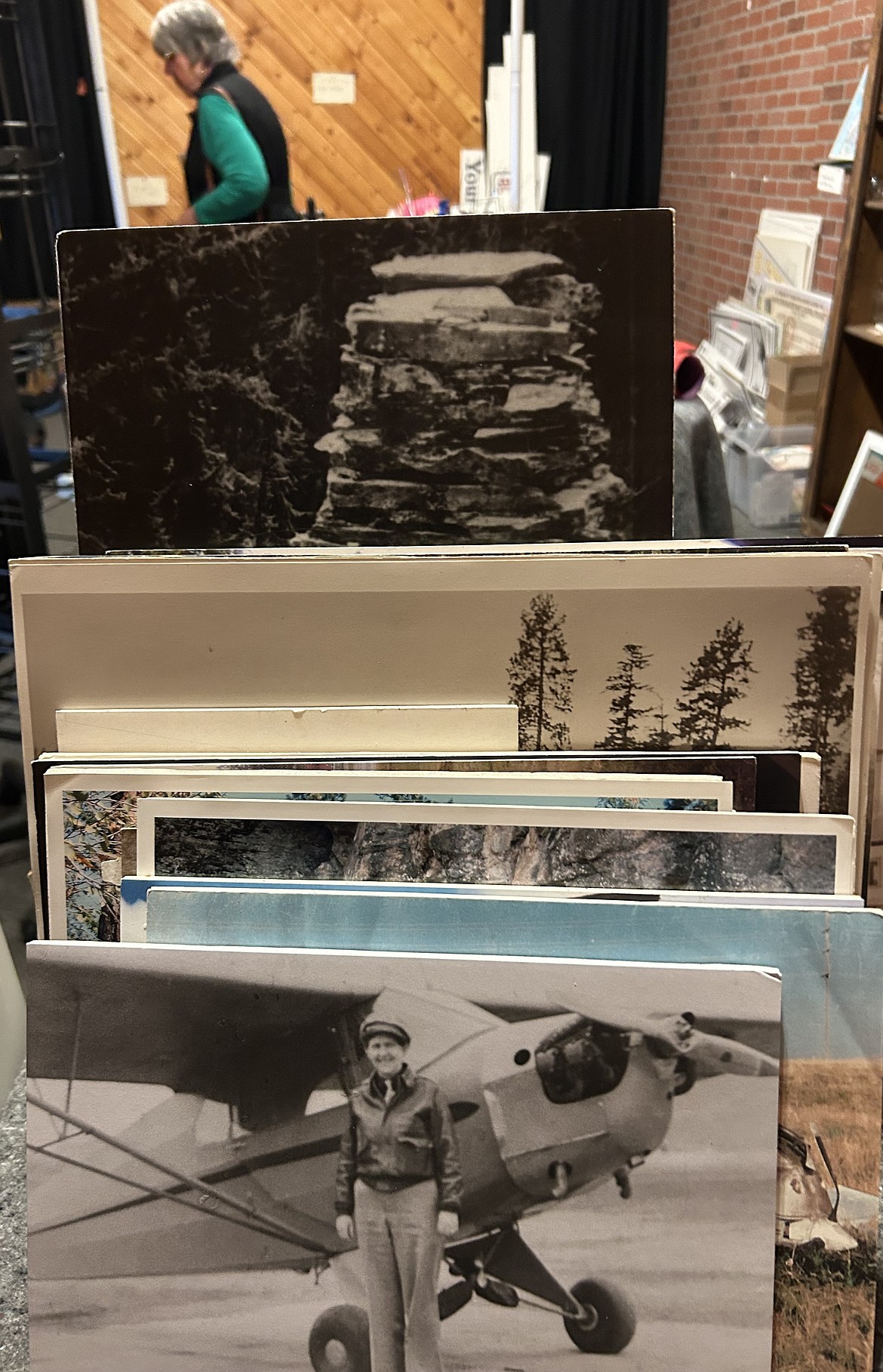 Old pictures rest in boxes at the Museum of North Idaho's moving sale on Thursday.