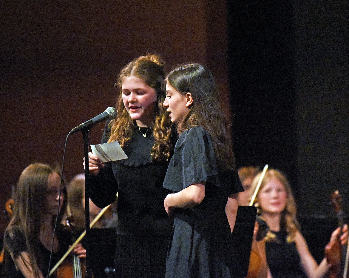Eighth graders Ada-Rose Petersen and Eleanor Parsons at a spring orchestra concert at the PAC on May 22. (Kelsey Evans/Whitefish Pilot)