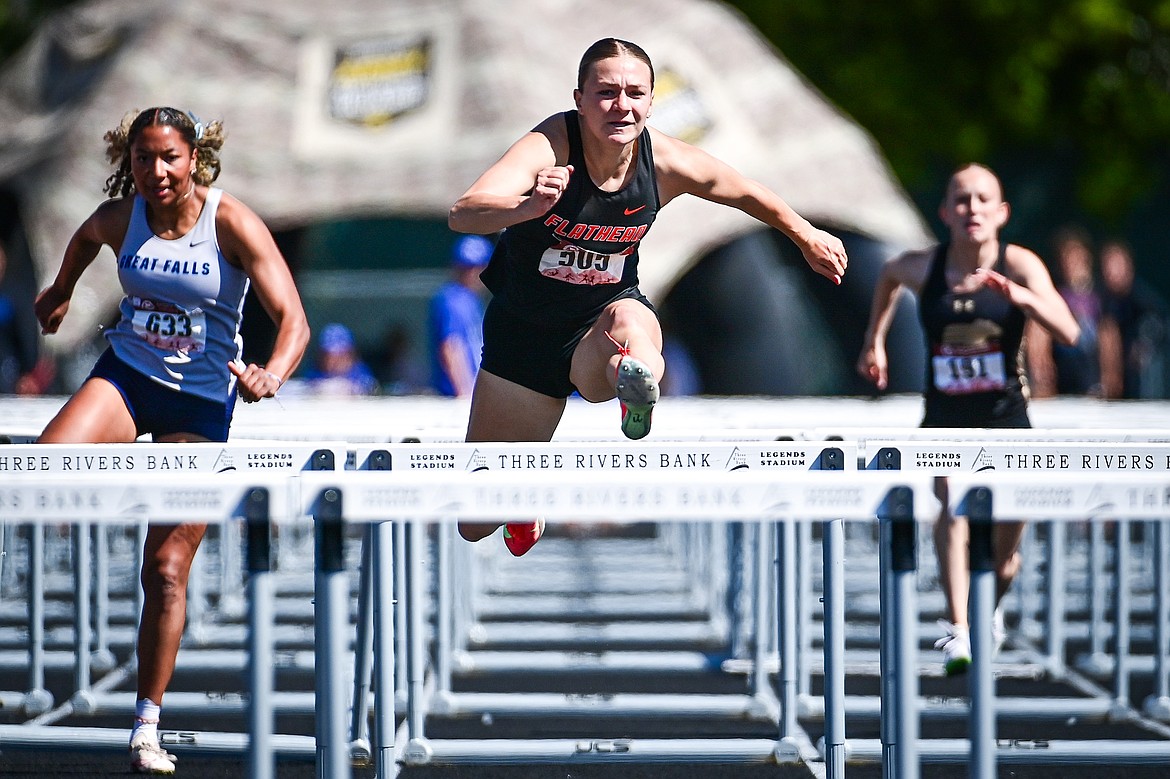 Flathead's Alivia Rinehart clears a hurdle en route to a first place finish in the girls 100 meter hurdles at the Class AA state track and field meet at Legends Stadium on Saturday, May 24. (Casey Kreider/Daily Inter Lake)