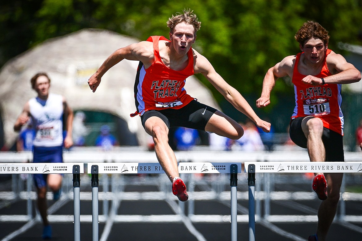 Flathead's Will Hollensteiner and Lane Chivers clear the final hurdle for a first- and second-place finish in the boys 300 meter hurdles at the Class AA state track and field meet at Legends Stadium on Saturday, May 24. (Casey Kreider/Daily Inter Lake)