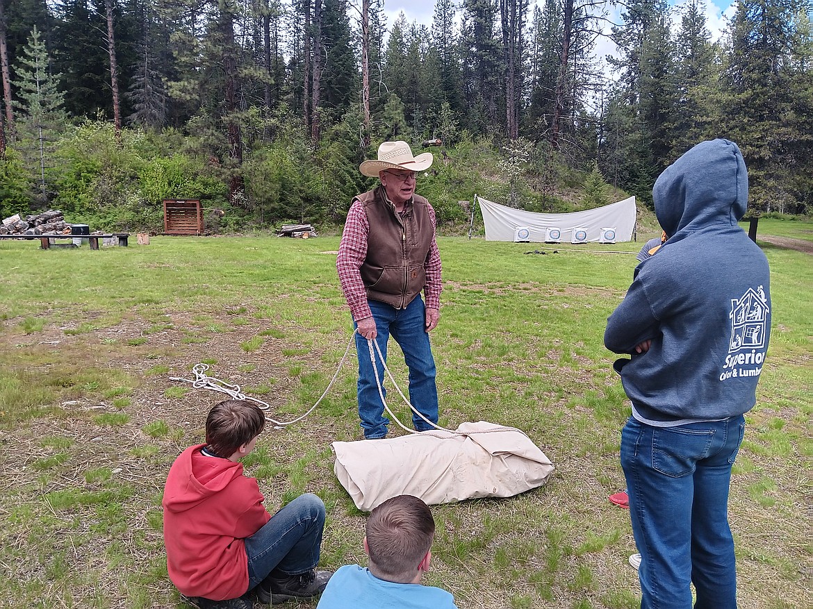 Dave Crawford has been packing over 40 years, and his manties are almost a work of art. But he explains that the weight and balance is too important to rush through so packing must be done with care. (Monte Turner/Mineral Independent)
