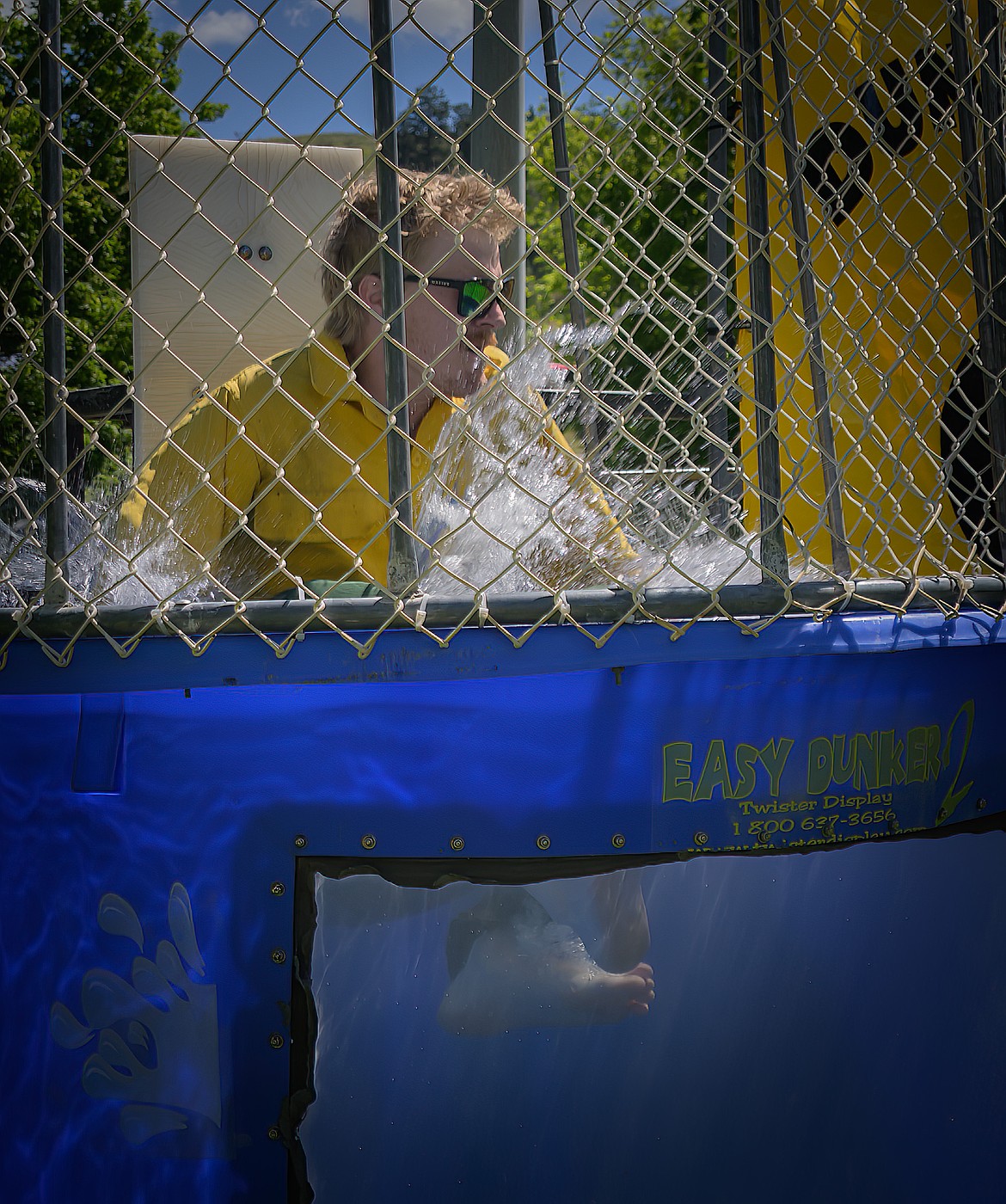 DNRC firefighter Andrew McCalmant on the way down after Rafe Bache throws a bullseye. (Tracy Scott/Valley Press)