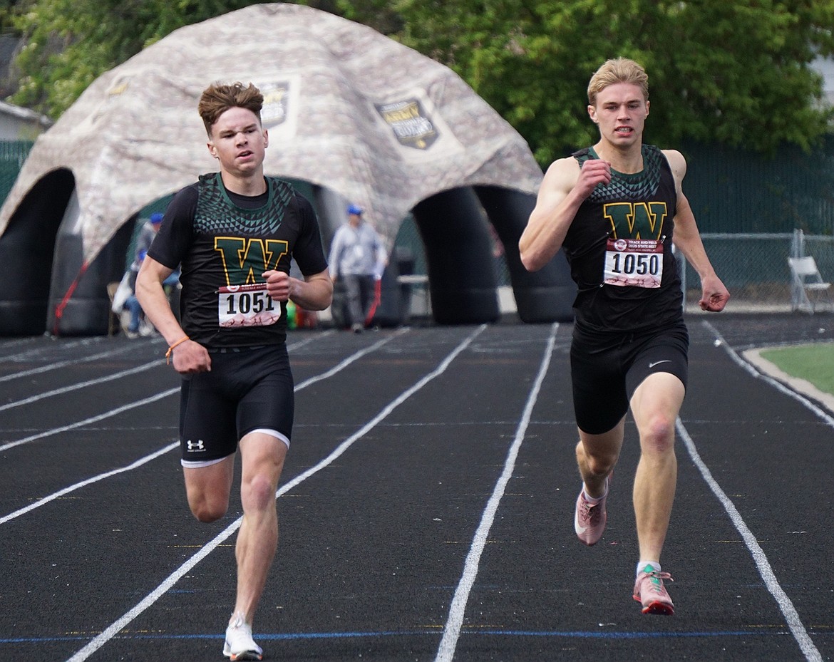 Whitefish Bulldogs Colby Minton (left) and Preston McPherson (right) compete in the Men's 400-meter race on Friday at the State Championship meet. Minton ended up in the sixth position overall with a time of 50.57. (Matt Weller photo)