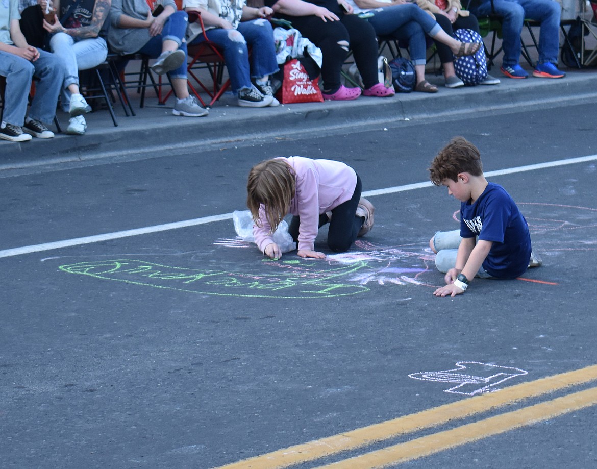 Budding artists have Third Avenue for their canvas during the Spring festival Saturday.