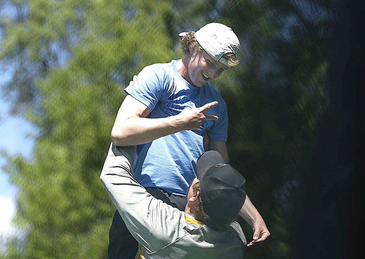 Libby Loggers head tennis coach Kyle Hannah lifts senior Ryan Beagle in celebration after Beagle won the Montana Class A singles tennis championship Friday, May 23, 2025, in Billings. (Amy Lynn Nelson/Billings Gazette)