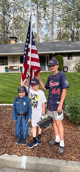 Courtesy photo
Members of the Coeur d'Alene Lumbermen American Legion baseball program spent Memorial Day placing 221 flags at residences in the community in the morning, then collecting them at night. The flag project is a partnership with the Lumbermen and the Kiwanis club. It honors the nation by displaying flags in neighborhoods in Coeur d'Alene, and helps develop a service attitude in the players. Pictured are brothers Camden, Mason and Blake Anderson; Blake plays for the Lums 14U team.