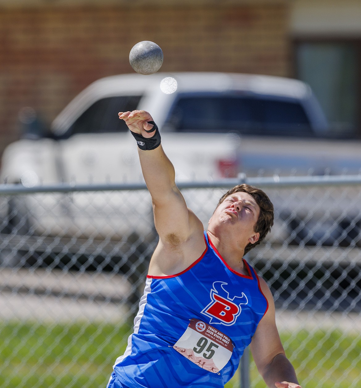 Trent Scherfenburg throws the shot at the Montana state AA and A track and field championships.