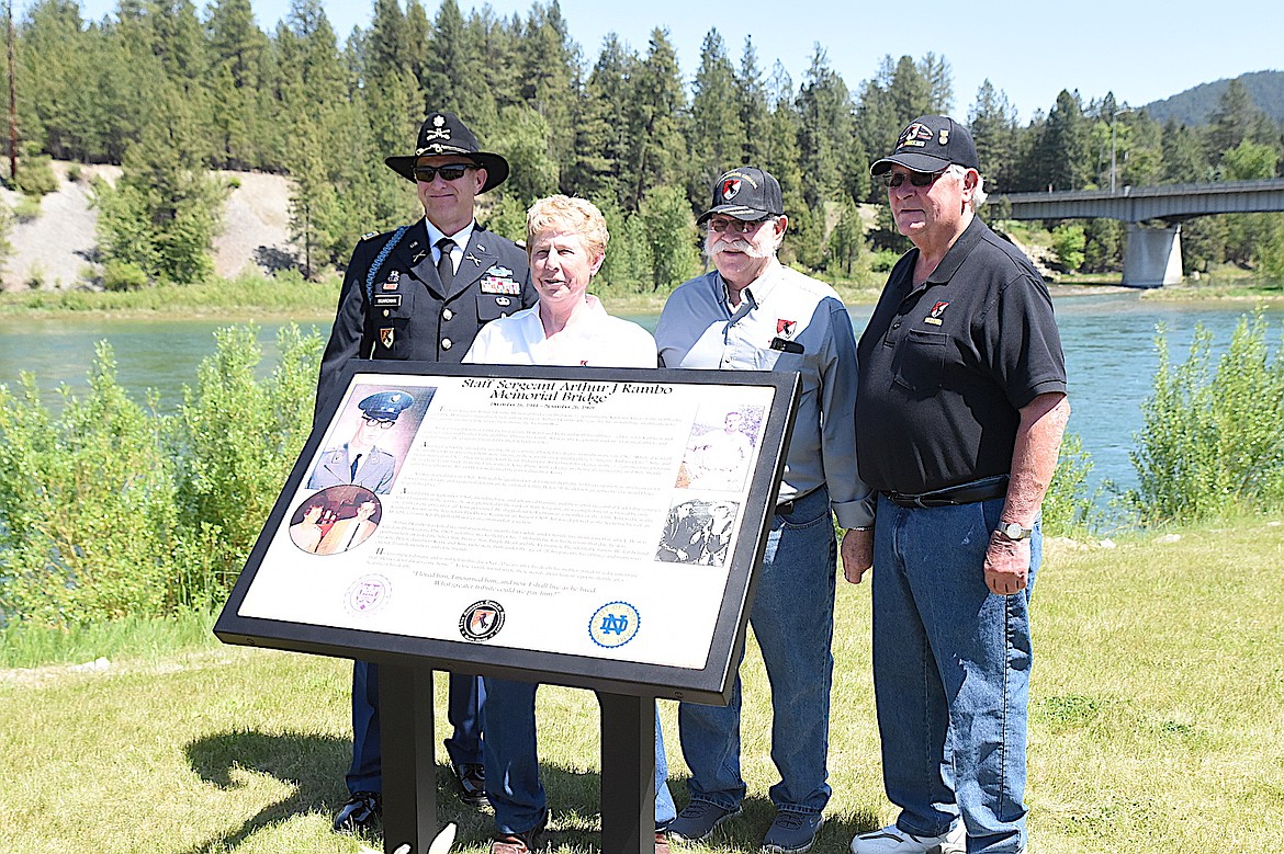 Blackhorse 11th Armored Cavalry Regiment members, from left, Mark Boardman, Mark Van Atta and Homer Rusteberg joined Patty Rambo Sunday, May 25, 2025, at the Arthur J Rambo Memorial dedication in Riverfront Park in Libby, Montana. (Scott Shindledecker/The Western News)