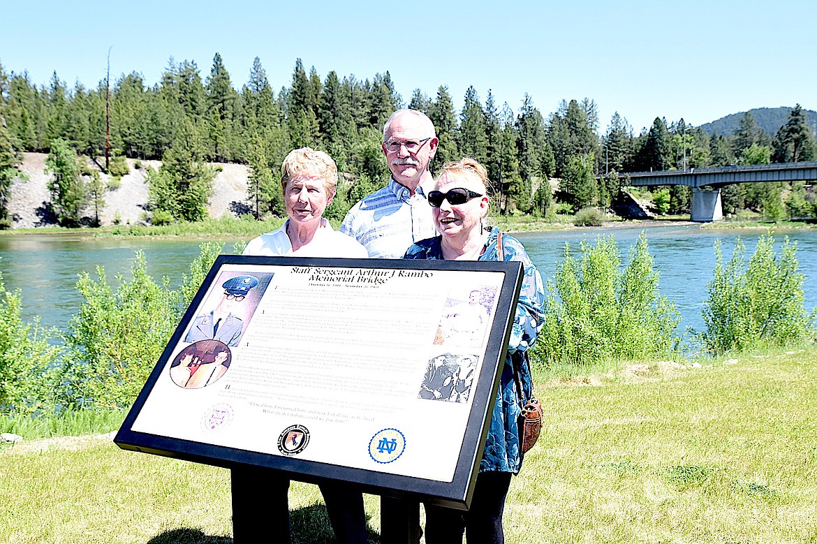 Siblings Patty Rambo, Dan Rambo and Kathleen Bache observe the memorial in honor of their brother, Arthur J Rambo, during a ceremony Sunday, May 25, 2025, at Riverfront Park in Libby, Montana. (Scott Shindledecker/The Western News)