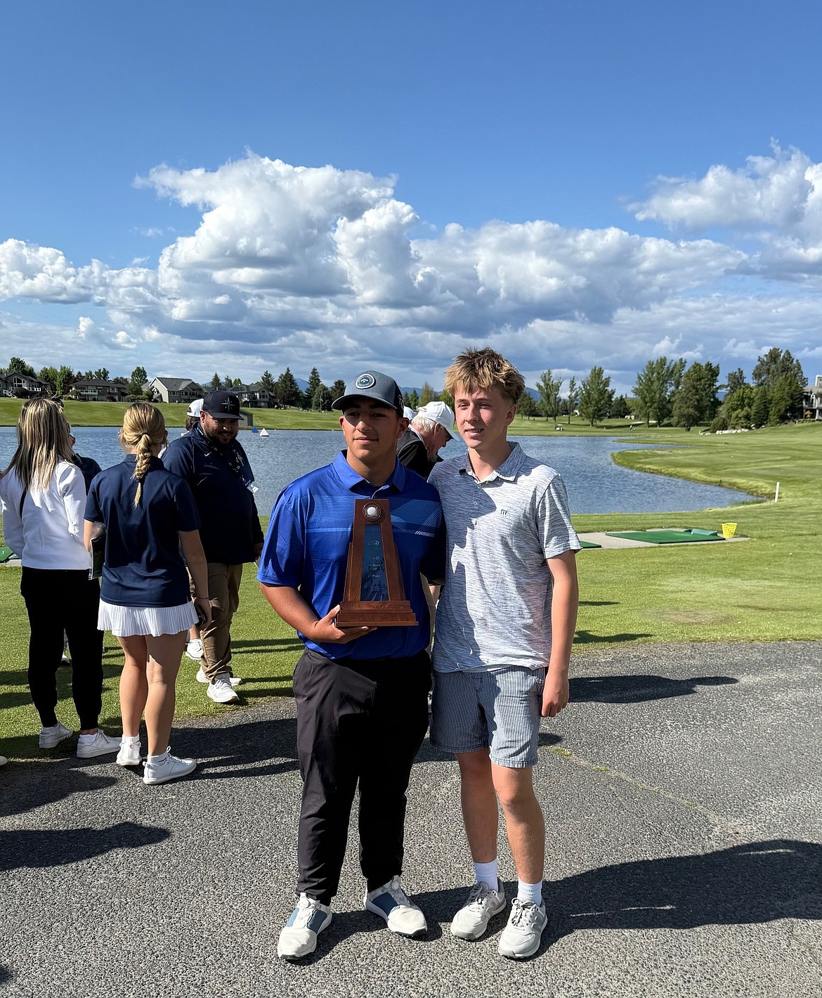 Jaden Hernandez and JJ Madsen stand with the trophy they earned at the state tournament. This is the first state trophy earned by the team since 1993.