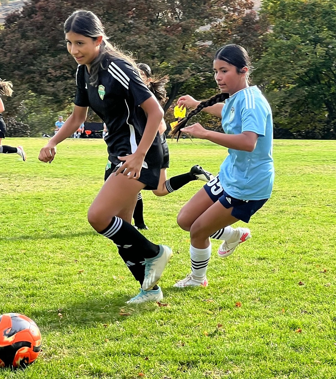 Gisell Pacheco maneuvers behind her opponent to try and steal the ball.