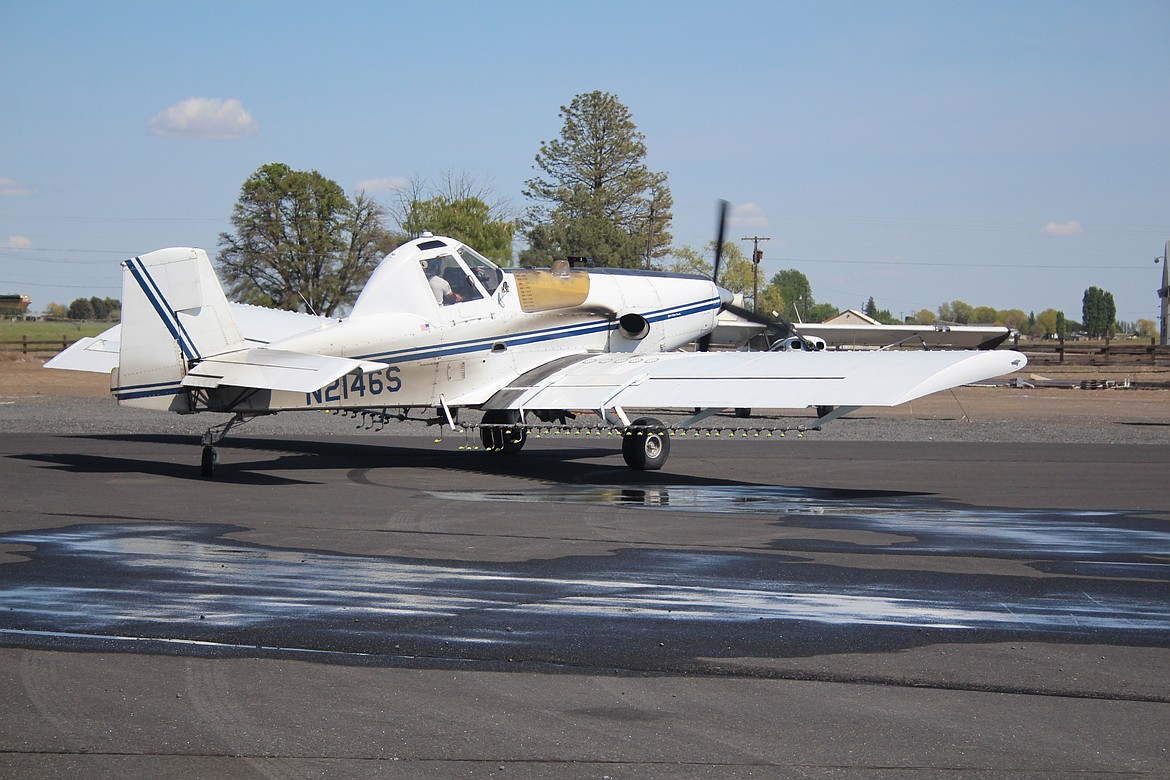 A Northwest Ag pilot returns to the strip for another load.