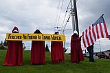 'Handmaids' protest at Idaho Rep. Fulcher's office in Coeur d'Alene